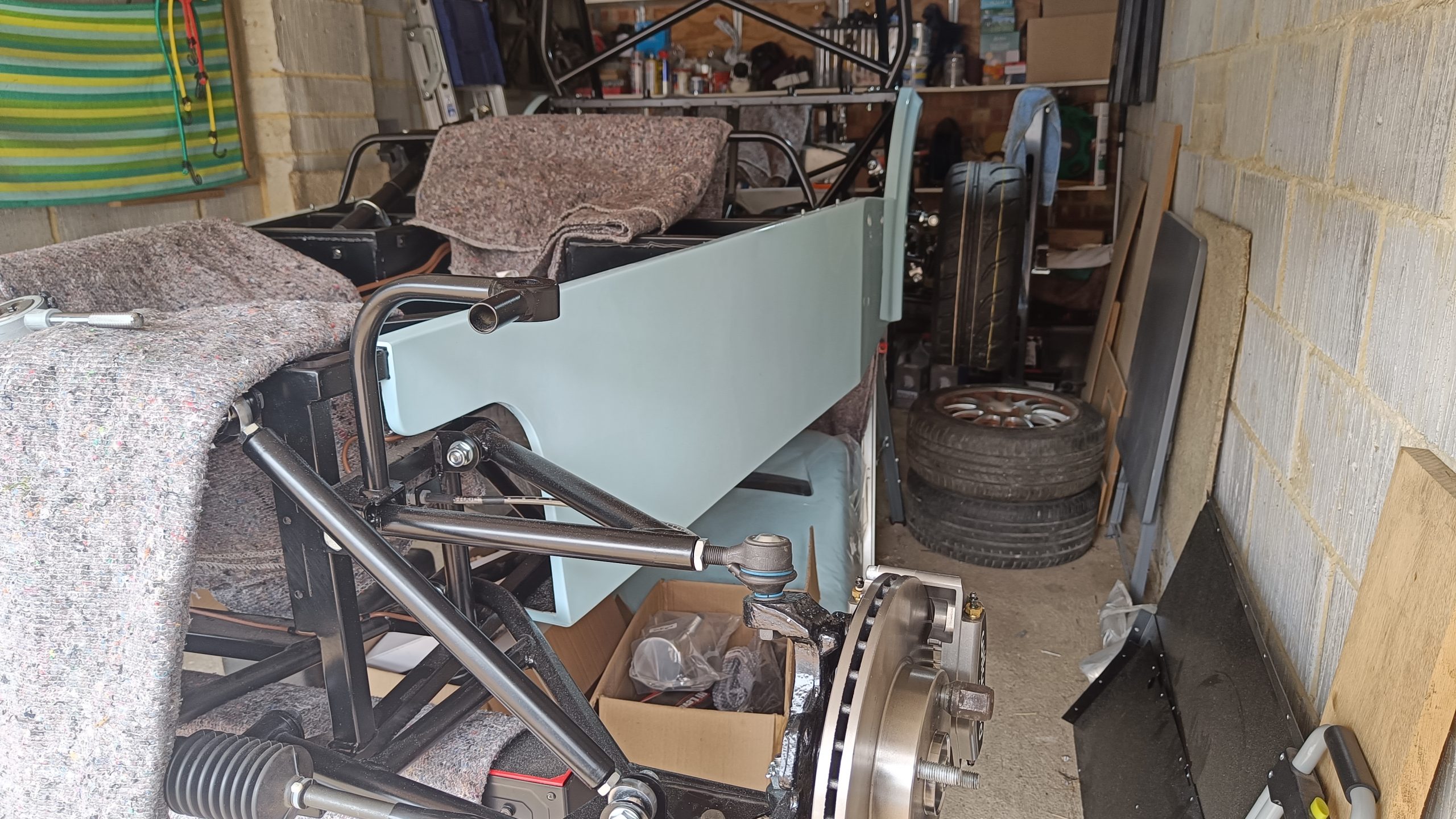 Image of NS showing rear wheels on, still supported on trestle however.