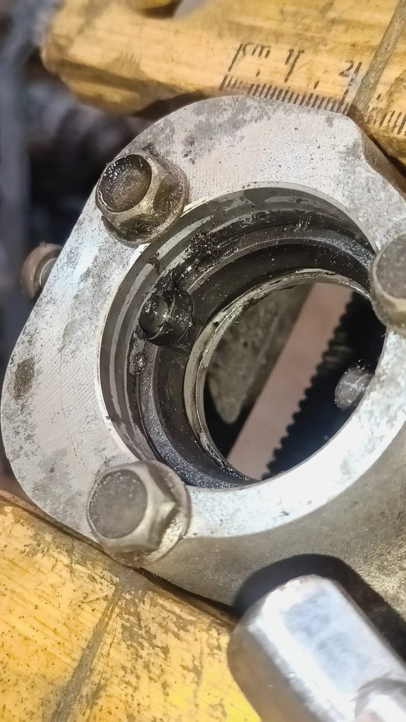 Image of shifter turrent with pin tapped back to remove lower bush.