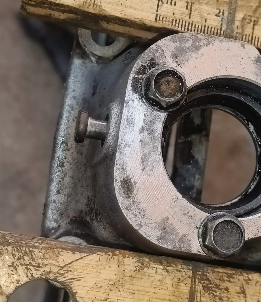 Image of shifter turrent with pin tapped back to remove lower bush.