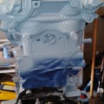Image of front of engine head now painted with VHT primer.