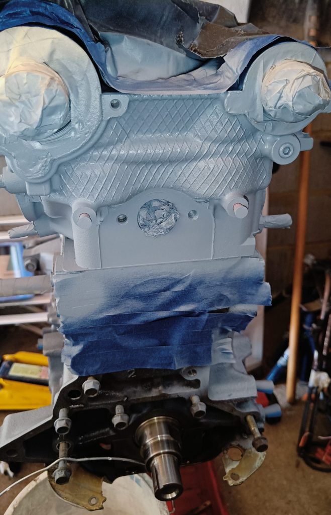 Image of front of engine head now painted with VHT primer.