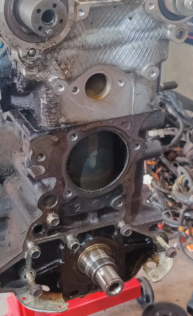 Image of front of engine block and head stripped an ready for paint.