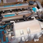 Image of engine with refurbished and painted parts reinstalled.