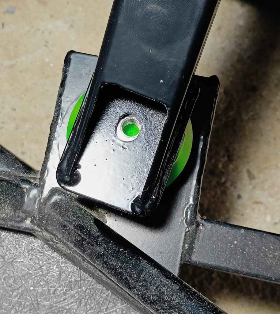 Image of newly installed polyurethane engine mount ready for upper stud and nut.