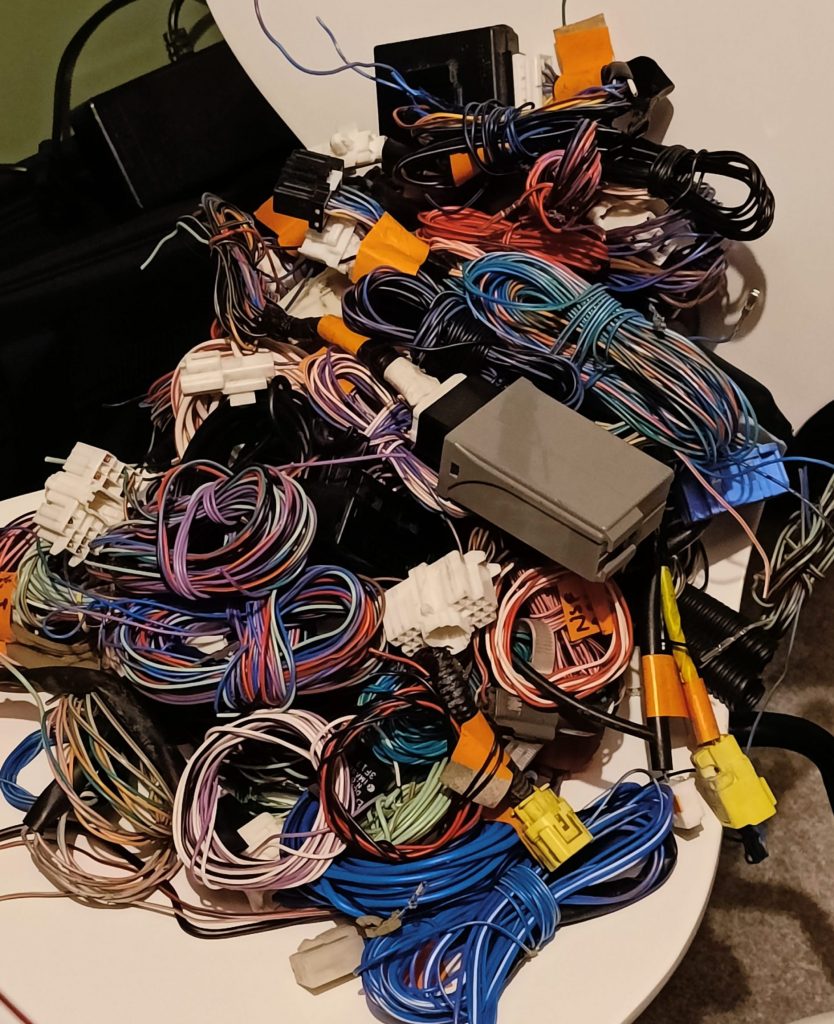 Image of some of the wires and modules removed from the loom so far.