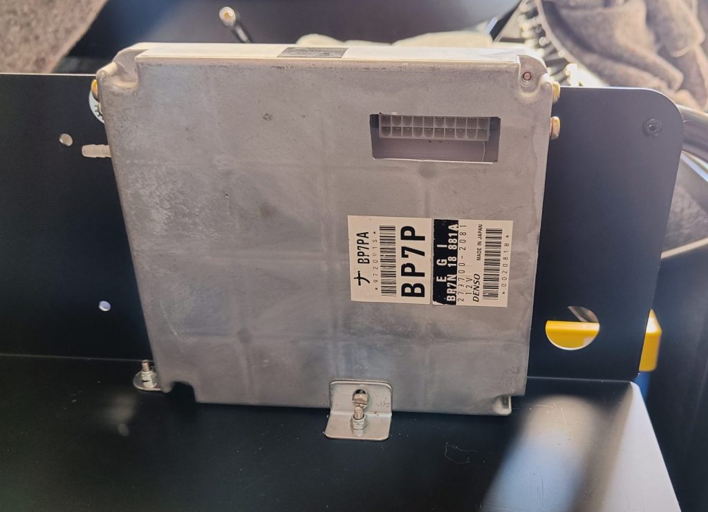 Image of ECU installation utilising existing casing bolt fittings.