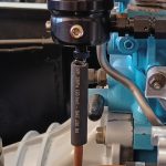 Image of fuel pressure regulator and fuel return pipe.