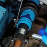 Image of rearward fuel pipe support under inlet manifold.
