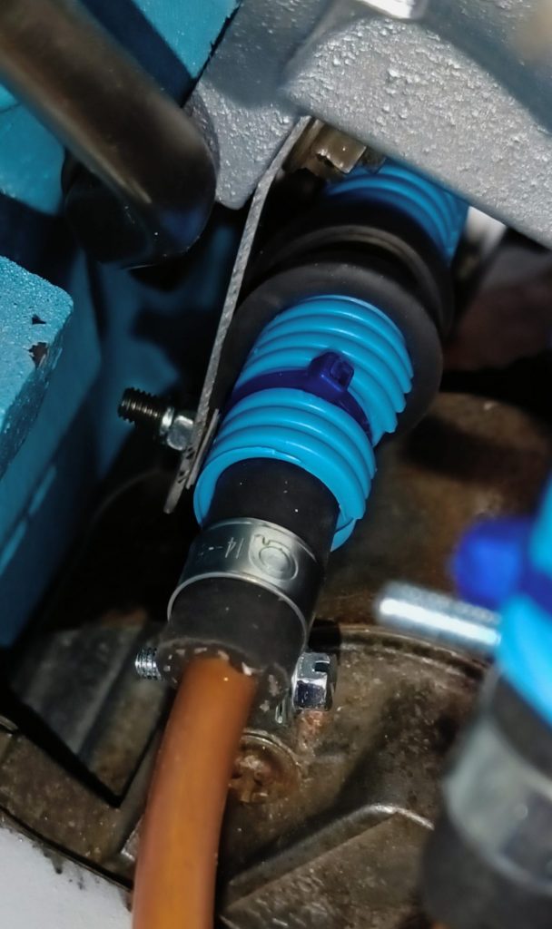 Image of rearward fuel pipe support under inlet manifold.