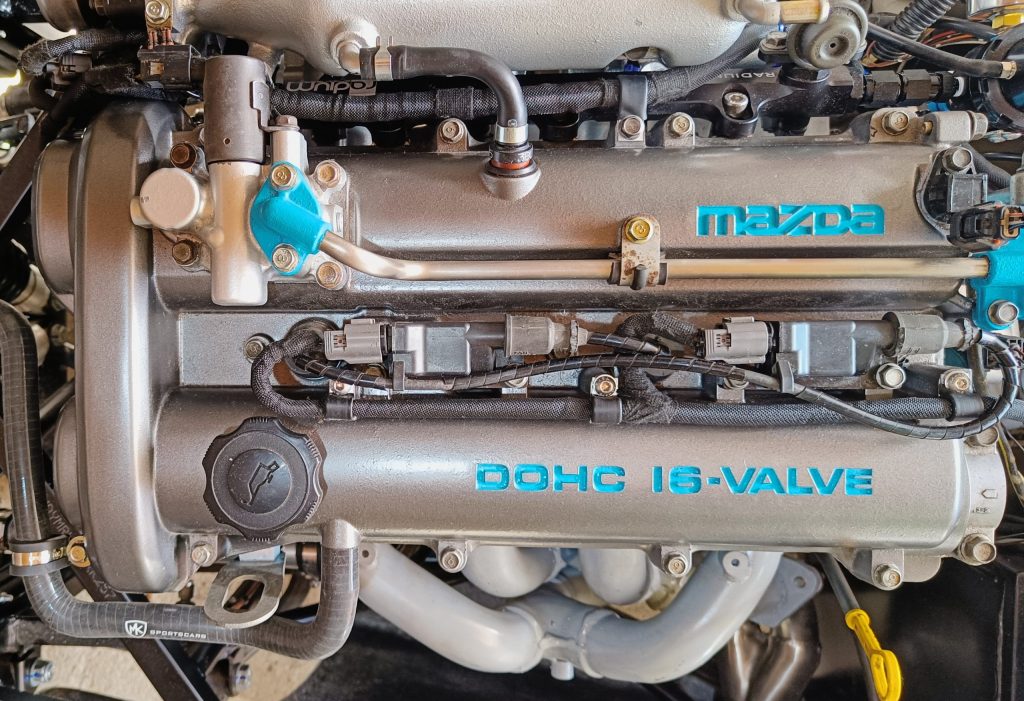 Image of top of engine showing newly wrapped engine loom installation.