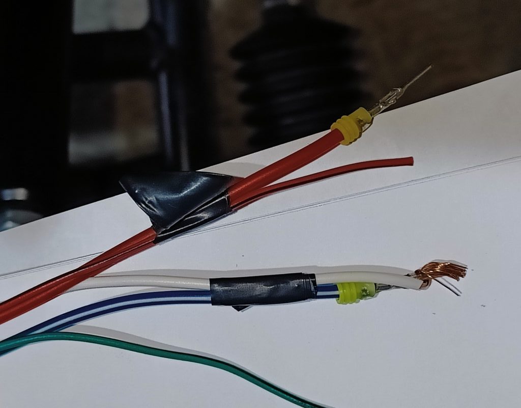 Image of two more headlamp wires and their Mazda partners.