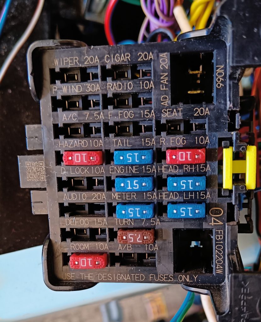 Image of internal fuse box with the only fuses remaining being those needed on the RX5