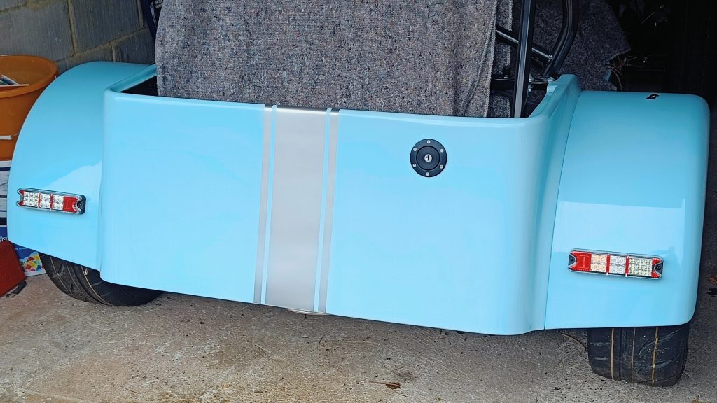 Image of rear of MK with silver stripe now fixed into position