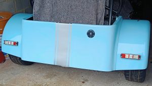 Image of rear of MK with silver stripe now fixed into position