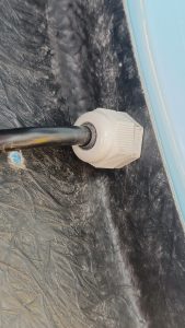 Image of rear light cabling passing through wing and body using a cable gland.