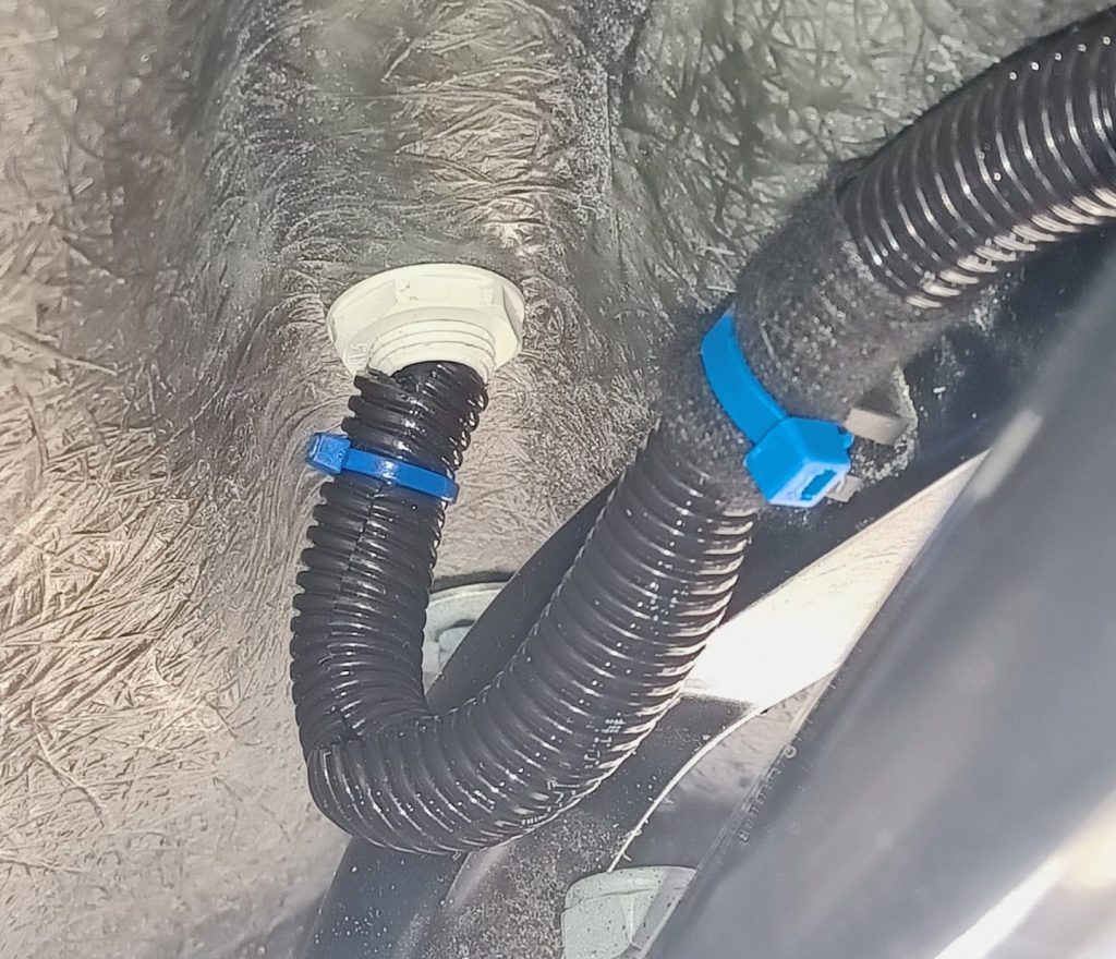 Image of rear light cabling passing through wing and body using a cable gland.