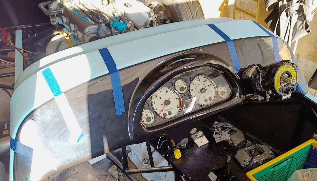 Image of dash panel in position and fixing holes drilled.